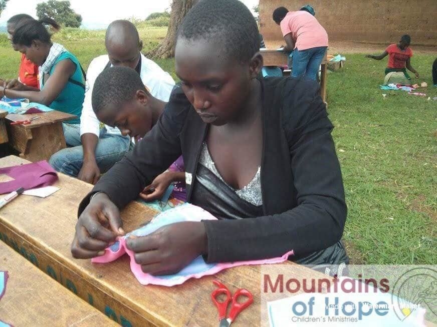 Train 700 girls to sew sanitary pads&face masks